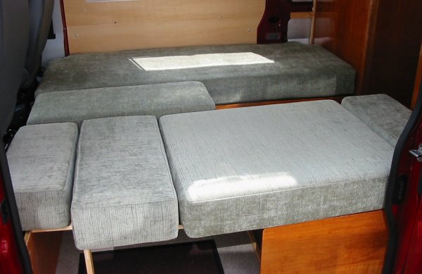 single beds with cushion in use as table