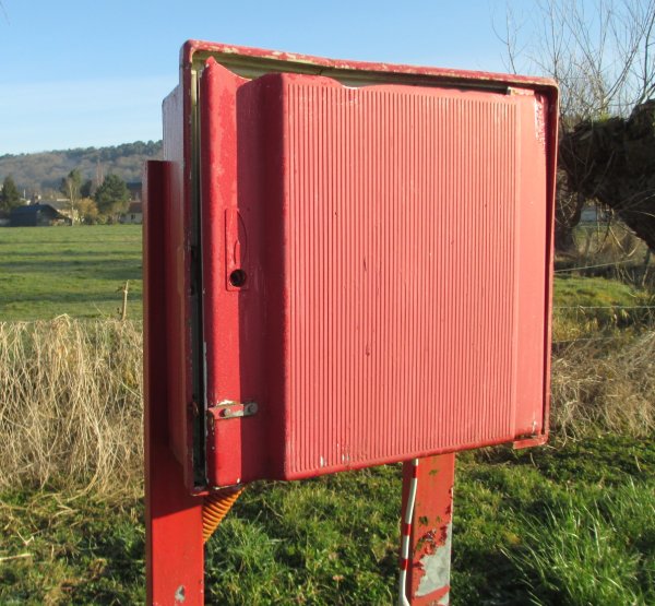 Red-painted metal box at Brionne site