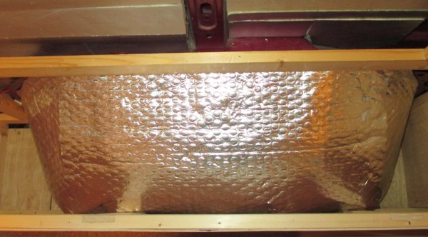 foil insulation covering wheel arch